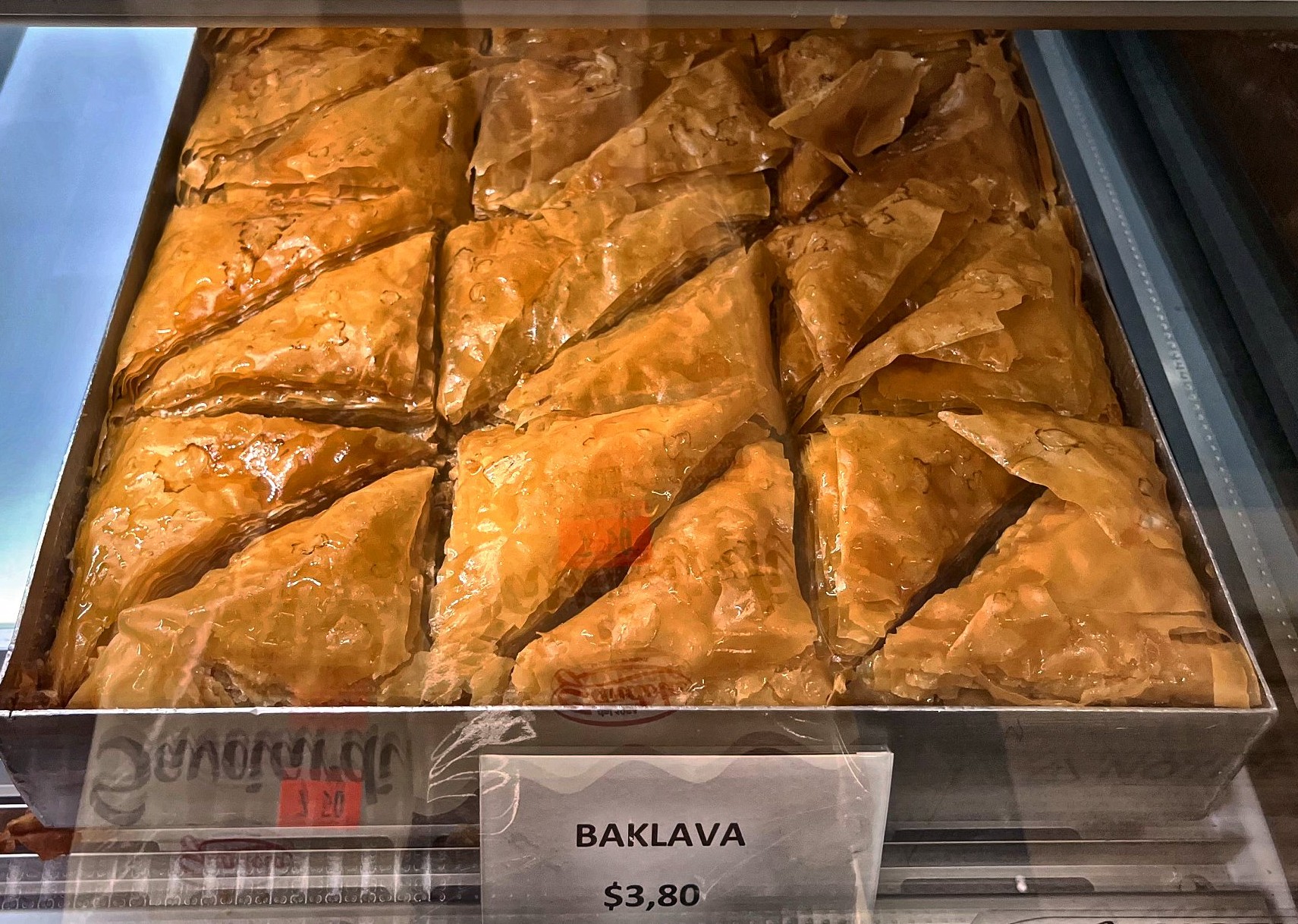 Golden baklava portions in the Kostas bakery case